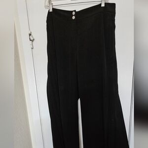 A formal black trousers with pleads